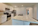 Beautiful kitchen featuring granite countertops and stainless steel appliances at 1040 Cambridge Drive, Winter Haven, FL 33881