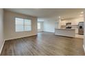 Spacious living room featuring stylish flooring and abundant natural light at 1040 Cambridge Drive, Winter Haven, FL 33881