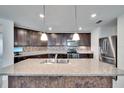 Beautiful kitchen with a large island, stainless steel appliances, and pendant lighting at 139 Sunfish Dr, Winter Haven, FL 33881