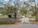 Charming home with fenced yard and mature landscaping at 820 N Carroll Rd, Lakeland, FL 33801