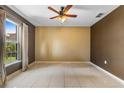 Spacious bedroom with tile flooring, a ceiling fan, and natural light at 913 Parasol Pl, Kissimmee, FL 34759