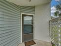 Inviting front door with screen provides ventilation and natural light, welcoming guests to this charming home at 222 Carpenters Way # 9, Lakeland, FL 33805