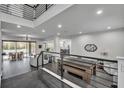 Open-concept living area with floor-to-ceiling windows, modern decor, and tile floors at 5406 Baytowne Place, Oviedo, FL 32765