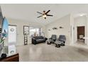 Bright living room featuring tile floors, modern ceiling fan, and comfortable seating area at 2337 St George Ave, The Villages, FL 32162