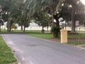 Scenic view of the road leading to a peaceful lakeside park and recreational area at 858 Lafayette Ln, Lakeland, FL 33805