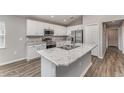 Modern kitchen with stainless steel appliances and granite countertops at 1047 Aruba Ave, Mulberry, FL 33860