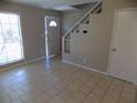 Inviting living room with neutral walls, tile flooring and natural light at 1424 Ridge Lake Ct, Lakeland, FL 33801