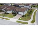 Inviting single Gathering home in residential neighborhood featuring neutral colors and tile roof at 168 Claffey Ct, Haines City, FL 33844