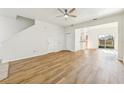 Bright open-concept living area with wood floors and natural light at 2938 Rodrick Cir, Orlando, FL 32824