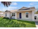 Attractive single-story home featuring a lush green lawn and a welcoming entrance at 3230 Baird Ave, Lakeland, FL 33805