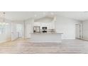 Bright kitchen with granite countertops, stainless steel appliances, and a breakfast bar at 3230 Baird Ave, Lakeland, FL 33805