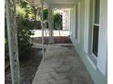 Charming front porch features decorative columns and patterned concrete flooring at 2502 Vine St, Orlando, FL 32806