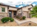 Inviting front entrance with stone accents, decorative details, and a charming tiled walkway at 9761 Sw 74Th Pl, Ocala, FL 34481