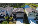 An aerial view capturing the home's position near a picturesque pond at 2244 Teneroc Trl, Lakeland, FL 33805