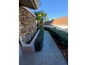 This home boasts a stone facade and a welcoming walkway, framed by lush greenery at 1135 Linkside Ct, Apopka, FL 32712