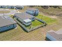 Aerial view of fenced backyard with screened in porch, perfect for outdoor enjoyment at 928 Cambridge Dr, Winter Haven, FL 33881