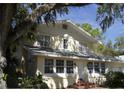 Classic two-story home with mature landscaping and a welcoming front entrance at 114 1St Nw St, Fort Meade, FL 33841