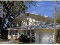 Charming two-story home with a well-manicured lawn and classic architectural details at 114 1St Nw St, Fort Meade, FL 33841