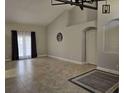 Spacious living room with high ceilings, tile flooring and large windows providing natural light at 2691 Cedaridge Cir, Clermont, FL 34711
