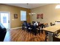 Dining room featuring a chandelier and a wood table with seating for six at 15387 Avenue Of The Arbors, Winter Garden, FL 34787