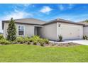Charming single-Gathering home with manicured lawn, two car garage, and beautiful green lawn at 2674 Sw 165Th Street Rd, Ocala, FL 34473