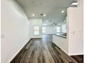 Open-concept living space with modern flooring and abundant natural light at 1390 Patricia St, Kissimmee, FL 34744