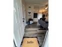 Inviting entryway featuring wood-look flooring and a welcoming 'hello' mat at 228 Babson Dr, Babson Park, FL 33827