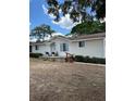 Charming single-story home with a quaint front porch and well-manicured landscaping at 228 Babson Dr, Babson Park, FL 33827