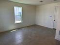 Well-lit bedroom with tile floors, light walls, and a window providing ample natural light at 15088 Grove Lake Dr, Winter Garden, FL 34787