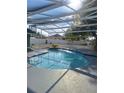 Beautiful screened-in pool with clear water, perfect for relaxation and outdoor enjoyment at 1000 Andrea Ridge Ct, Kissimmee, FL 34747