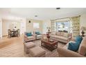 Spacious, staged living room with hardwood floors and neutral decor at 1841 5Th Se St, Winter Haven, FL 33880