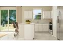 Clean kitchen with white cabinets, stainless appliances, and a view to the outdoor dining at 2618 Skyline Loop, Kissimmee, FL 34758