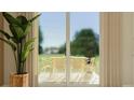 Outdoor dining area visible through sliding glass doors, perfect for entertaining at 2618 Skyline Loop, Kissimmee, FL 34758