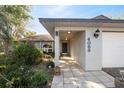 Inviting walkway leads to front entrance, surrounded by lush landscaping at 4089 Lehman Ln, Lakeland, FL 33813