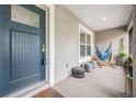 Relaxing front porch with a cozy hammock and stylish seating, perfect for enjoying quiet moments at 2155 Thompson Rd, Bartow, FL 33830