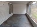 Enclosed porch with vinyl siding and views of the outdoor area at 5118 Log Wagon Rd, Ocoee, FL 34761