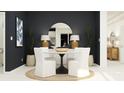 Stylish dining room with a round table, white chairs, and modern decor accents at 685 Peroni Ave, Debary, FL 32713