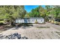 Charming single-story home featuring a well-maintained lawn and freshly painted siding at 4609 Creek Meadow Trl, Lakeland, FL 33810