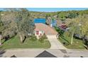 Beautiful home on a large lot with mature trees and lake view at 10837 Versailles Blvd, Clermont, FL 34711