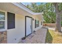 Charming home featuring stylish front entrance with a new door and exterior finishes at 2415 Sutton Rd, Lakeland, FL 33810