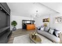 Spacious living area with sleek furniture and modern lighting fixtures at 1508 Leighton Ave, Lakeland, FL 33803