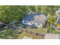 This home has a private fenced yard with patio furniture for outdoor living at 6125 Morningdale Ave, Lakeland, FL 33813
