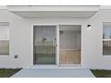 Outdoor patio featuring sliding glass door entry to interior at 1018 Foreshore Ln, Haines City, FL 33844