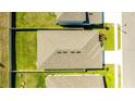 Aerial view of a single-Gathering home with a fenced backyard and a well-maintained roof at 2047 Rosewood Cir, Lakeland, FL 33810