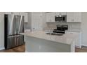Well-equipped kitchen with stainless steel appliances, and spacious countertops at 1538 Sage Ave, Haines City, FL 33844