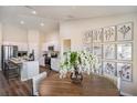 Dining area featuring modern decor, wood table, and a seamless transition to the kitchen at 1566 Sage Ave, Haines City, FL 33844