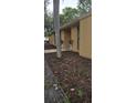 This home features a well-maintained exterior with fresh mulch and tasteful landscaping at 31632 Spruce Dr, Eustis, FL 32736
