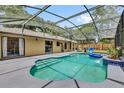 A screened-in backyard swimming pool features tiled steps and concrete pool deck at 31632 Spruce Dr, Eustis, FL 32736