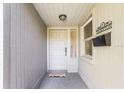 Welcoming front entrance features a classic white door, decorative accents, and a charming porch at 3247 S Polk Ave, Lakeland, FL 33803