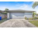 Attached two-car garage featuring a large, secure door and a paved driveway at 3247 S Polk Ave, Lakeland, FL 33803